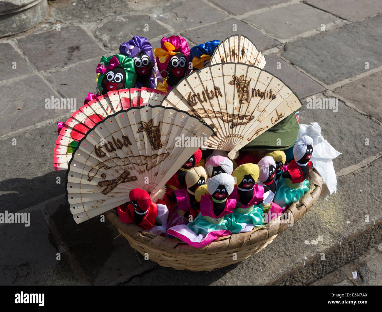 basket of tourist doll and fan souvenirs, old Havana, Cuba Stock Photo