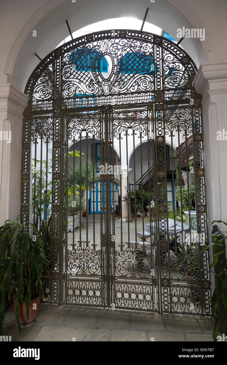 courtyard and iron gate, Palacio de los Marquesas de Arcos, Havana, Cuba Stock Photo