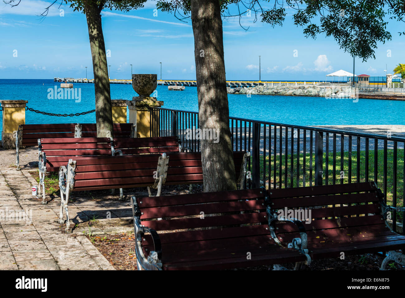 A waterfront seating area near the Frederiksted pier, a port for cruise ships in Frederiksted, St. Croix, U. S. Virgin Islands. Stock Photo