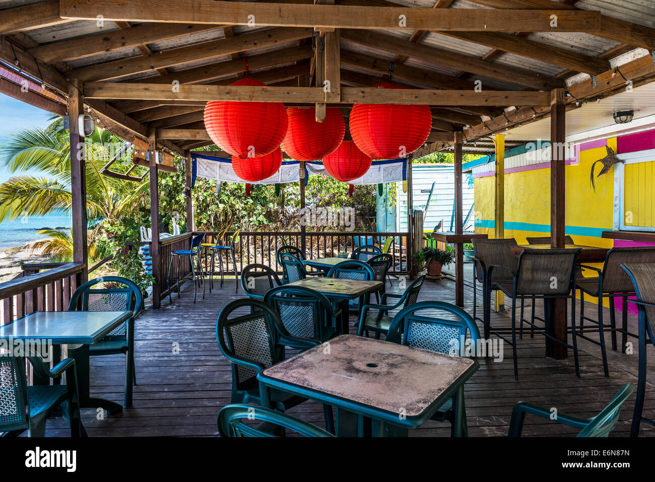 The outdoor patio of a beachside restaurant called Coconuts on the Beach in Frederiksted,St. Croix, U. S. Virgin Islands. USVI, U.S.V.I. Stock Photo