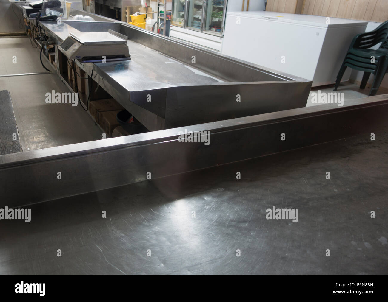 empty bins in fish store with no customers Stock Photo