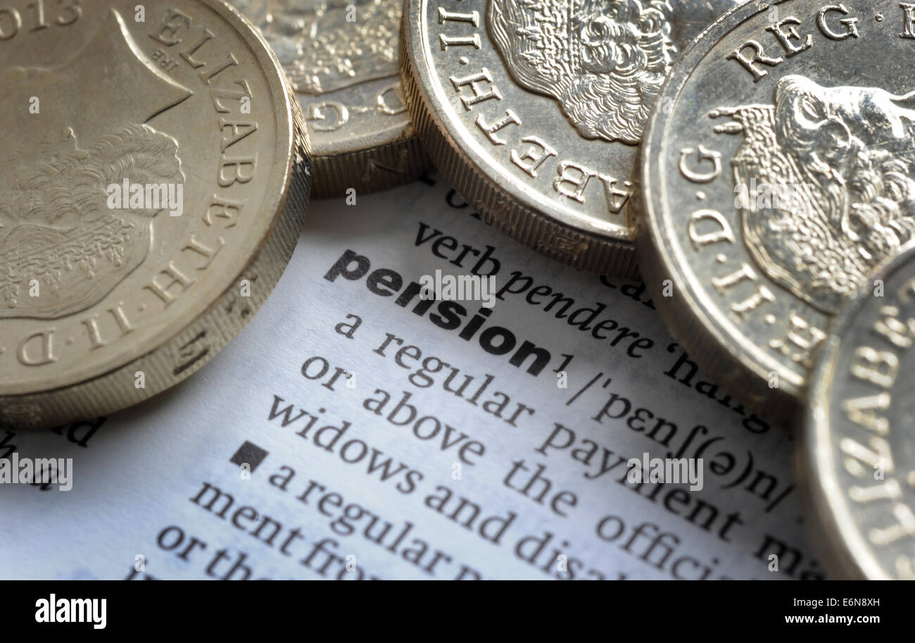DICTIONARY DEFINITION  OF PENSION AND ONE POUND COINS RE WAGES INCOMES MORTGAGES  PRIVATE COMPANY PAYMENT PAYSLIP RETIREMENT UK Stock Photo