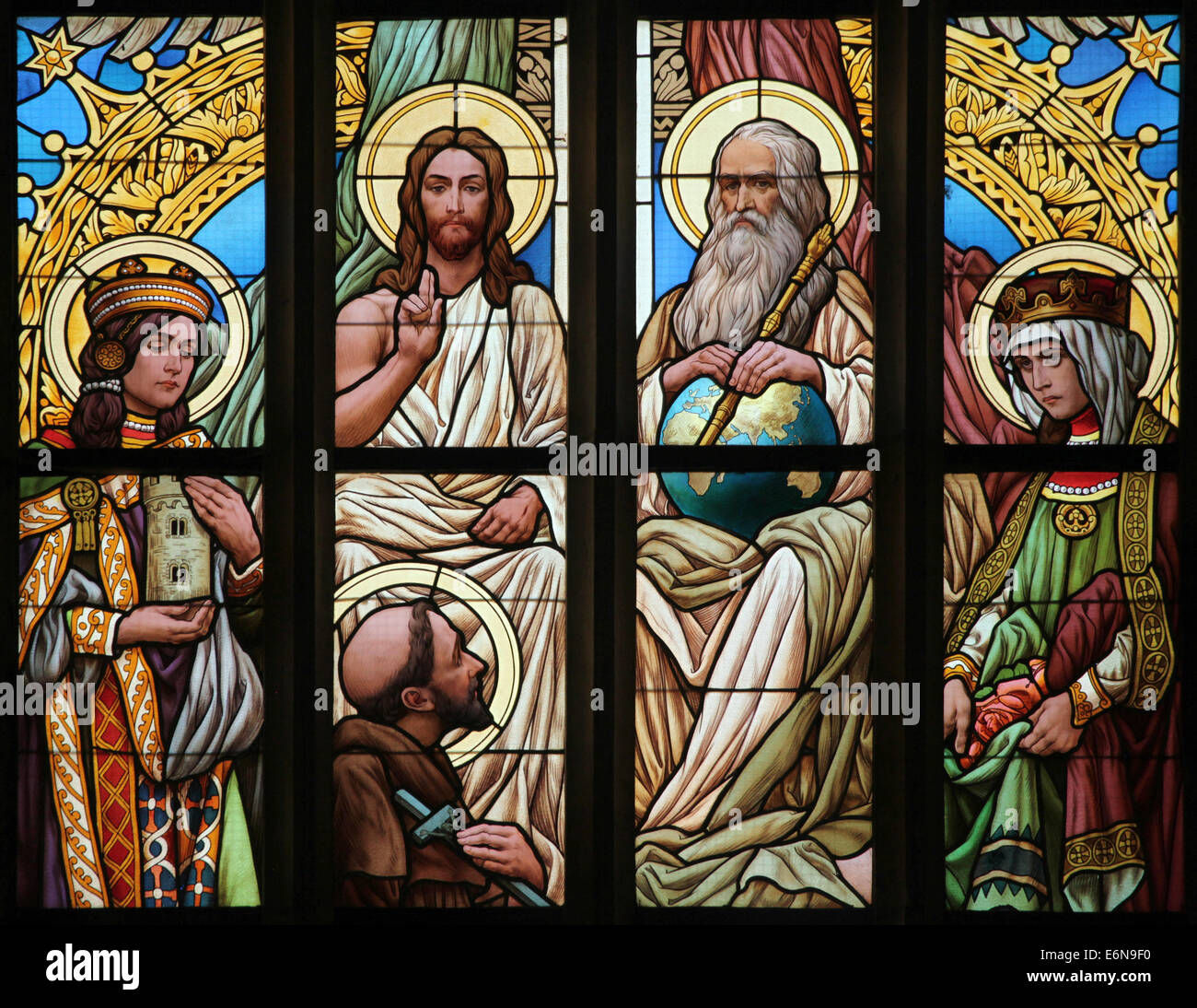 The Holy Trinity. Stained glass window in Saint Barbara's Church in Kutna Hora, Czech Republic. Stock Photo