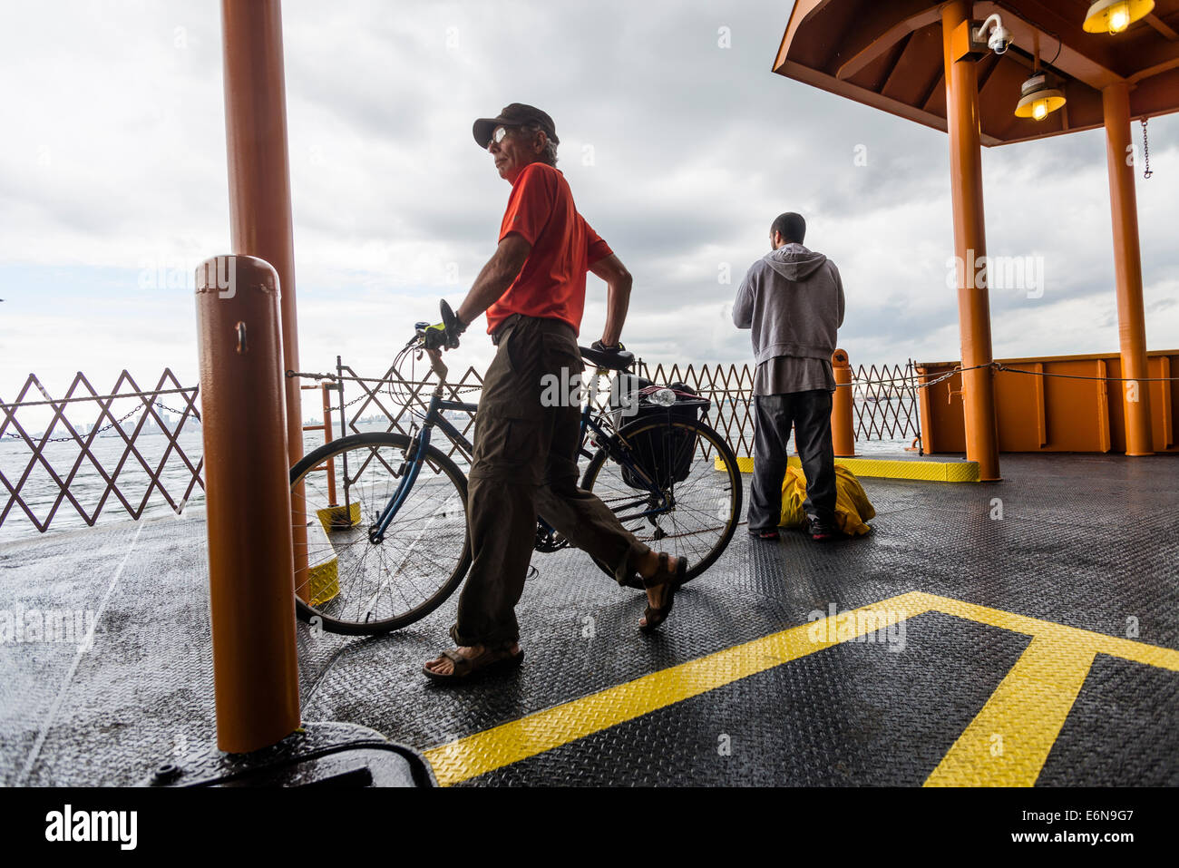 Staten Island, NY - 23 Aug 2014 - Bicycle commuter on the Staten Island Ferry Stock Photo
