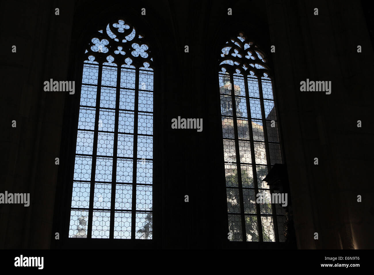 The Baroque tower of the Jesuit College seen through the Gothic windows of Saint Barbara's Church in Kutna Hora, Czech Republic. Stock Photo