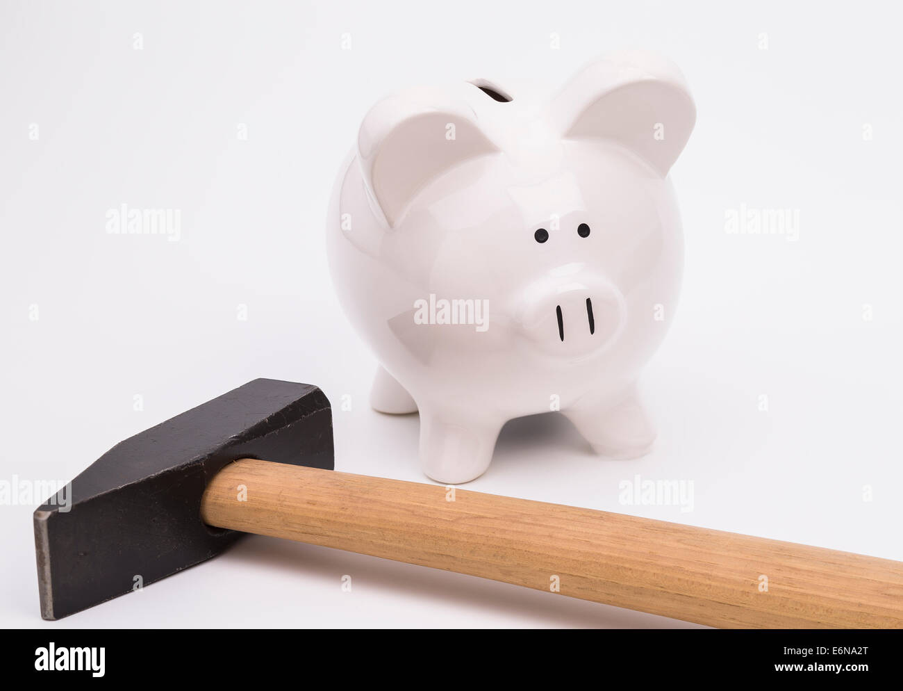 White piggy Bank and hammer on a white background Stock Photo - Alamy