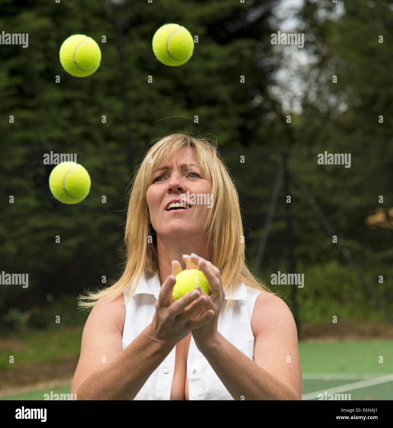 Tennis player juggling tennis balls Stock Photo Alamy