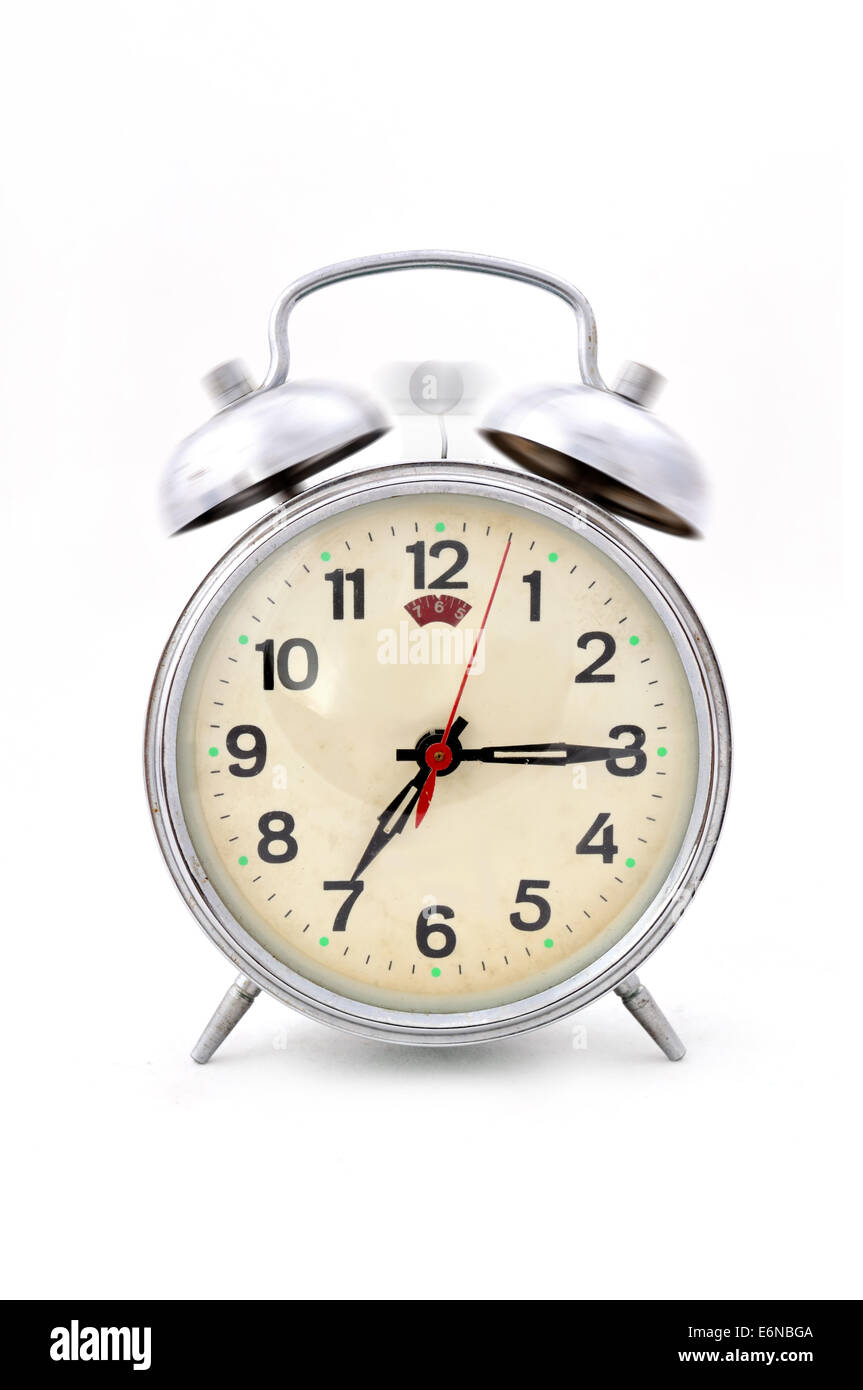 An oldfashioned alarm clock is ringing in the morning to get up early