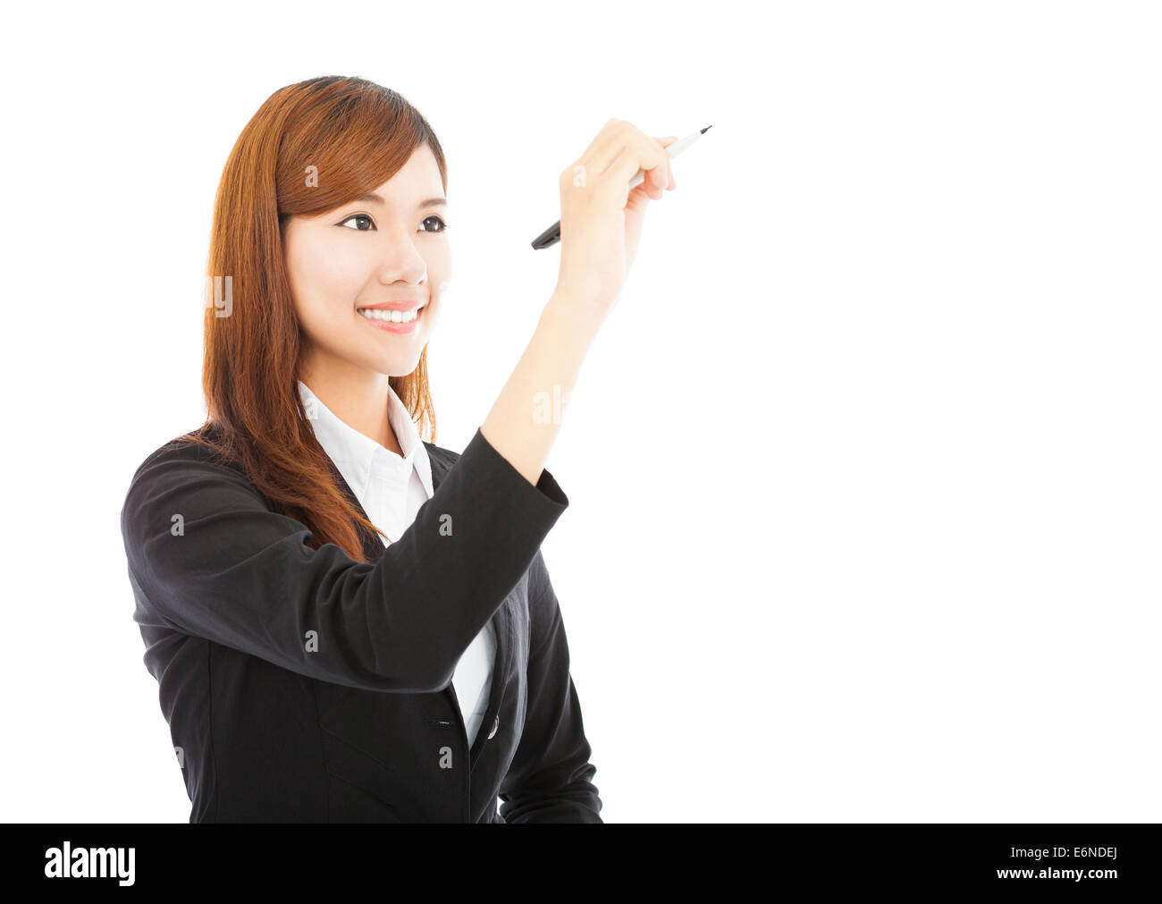 pretty business woman standing and holding a pencil Stock Photo - Alamy