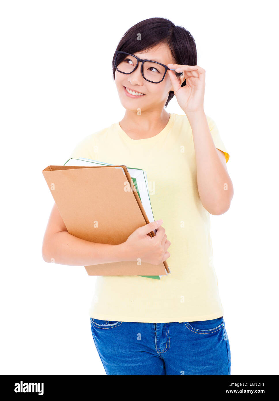 smiling young student girl standing and holding document over white ...