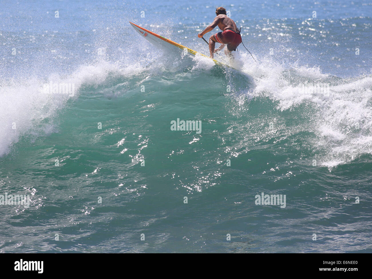Malibu, California, USA. 27th Aug, 2014. Professional surfer Laird Hamilton rides a wave in Malibu at Surfrider beach as big waves swelled by distant Hurricane Marie arrives at Southern California beaches. Credit:  ZUMA Press, Inc./Alamy Live News Stock Photo
