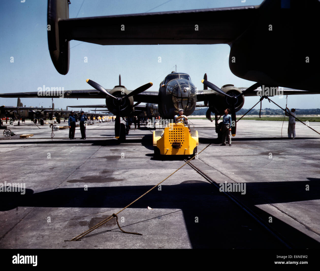 A fast, hard-hitting new A-20 [i.e., B-25] attack bomber is brought for a test hop to the flight line at the Long Beach, California, plant of Douglas Aircraft Company, 1942 Stock Photo