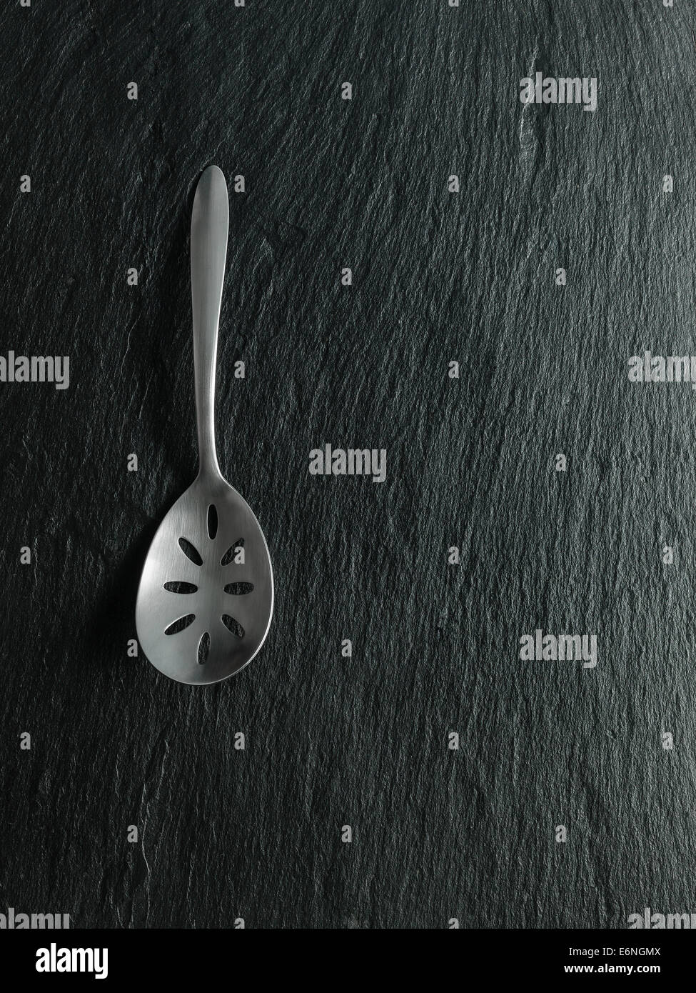 Serving Spoon on slate Stock Photo Alamy