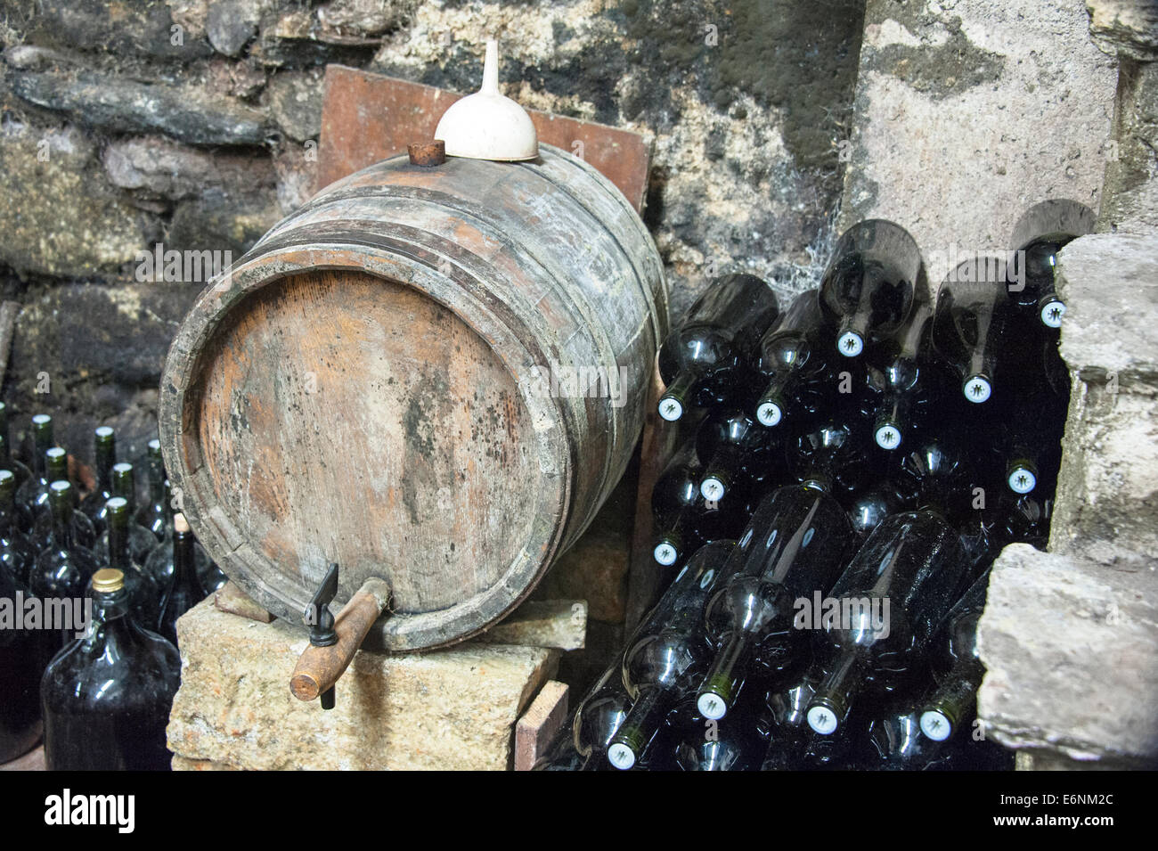 Old wine barrels and bottles in a cellar Stock Photo Alamy
