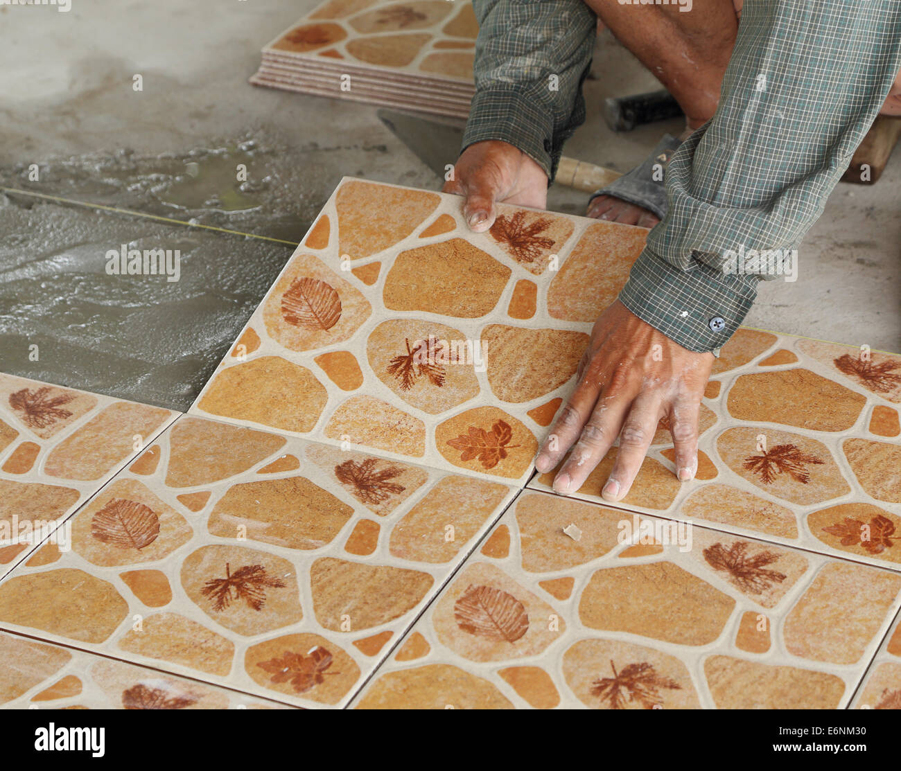 Installing ceramic floor tile hires stock photography and images Alamy