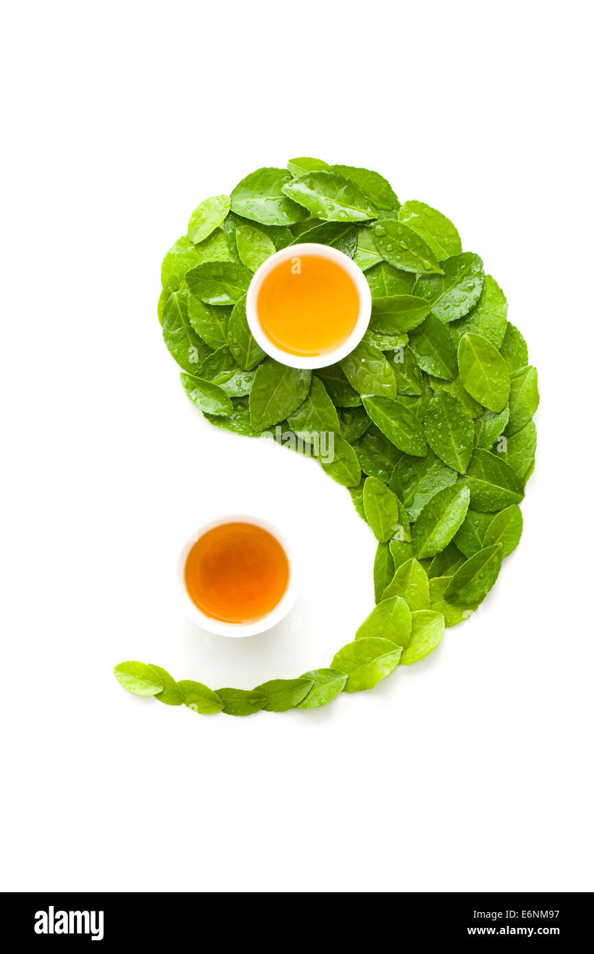 Tea cups and leaves in the shape of Yin Yang Symbol Stock Photo Alamy