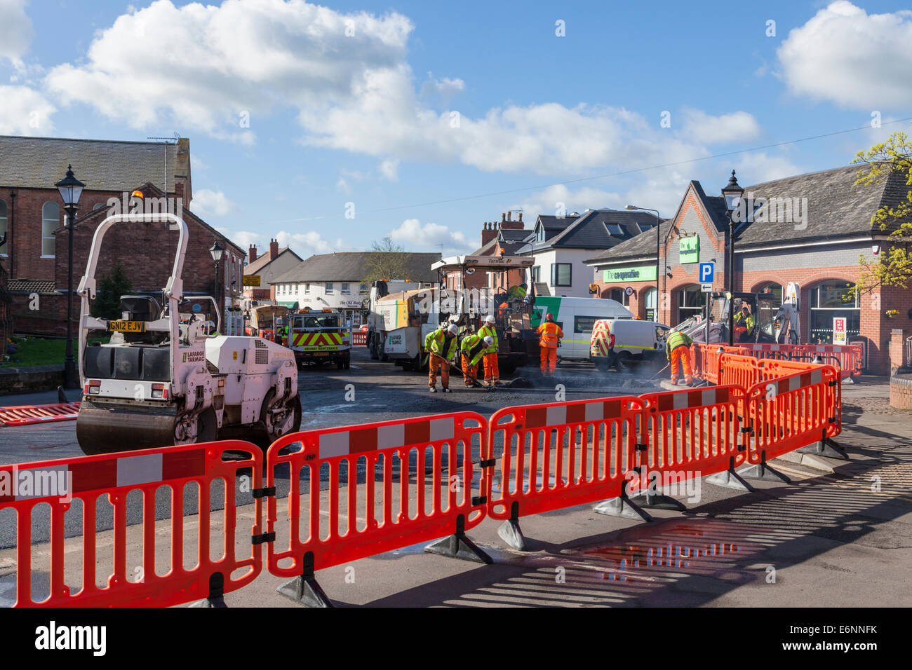 Road works. Road resurfacing work on a village street, Ruddington, Nottinghamshire, England, UK Stock Photo