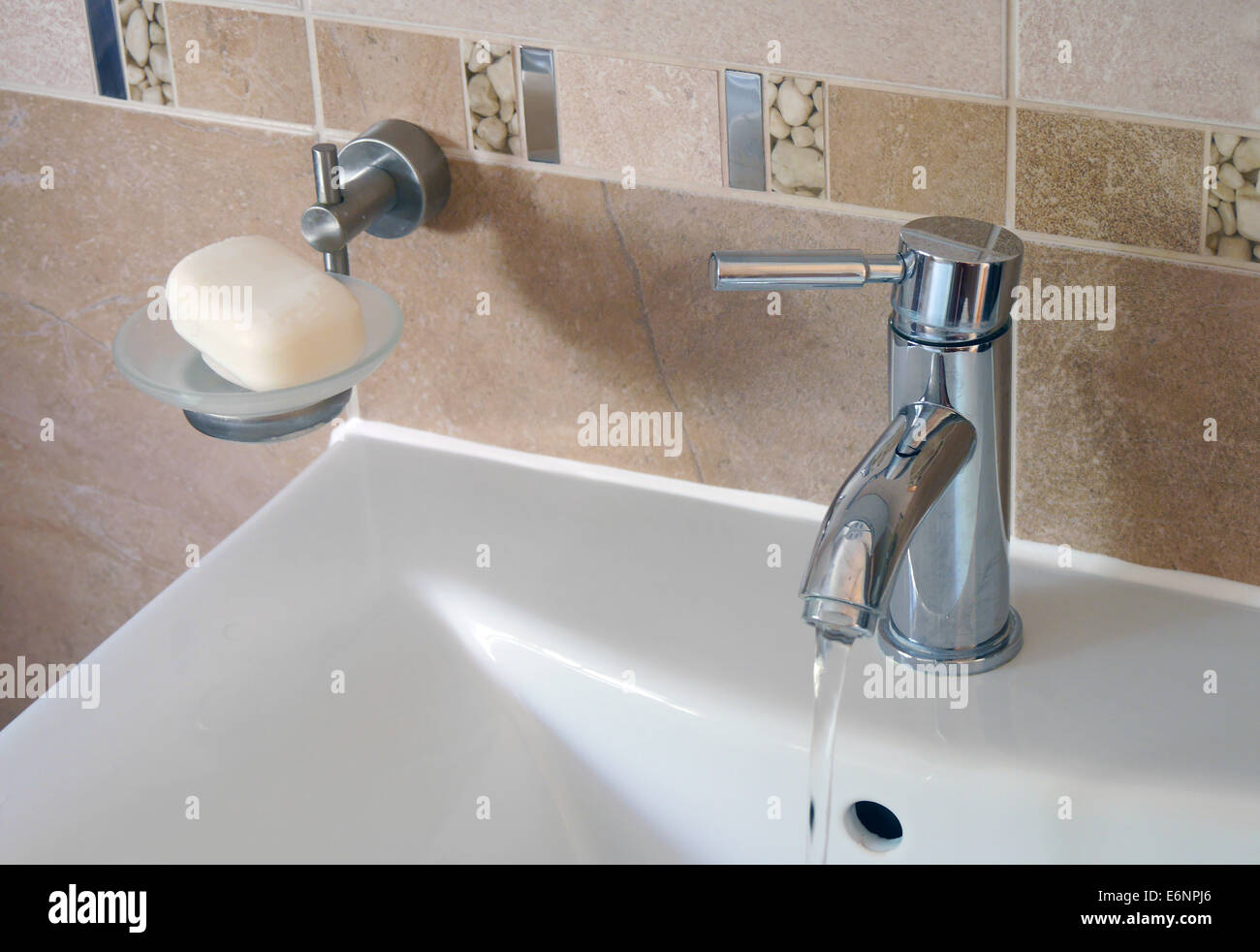 Closeup Of Running Water From Tap In Bathroom Sink Stock Photo Alamy