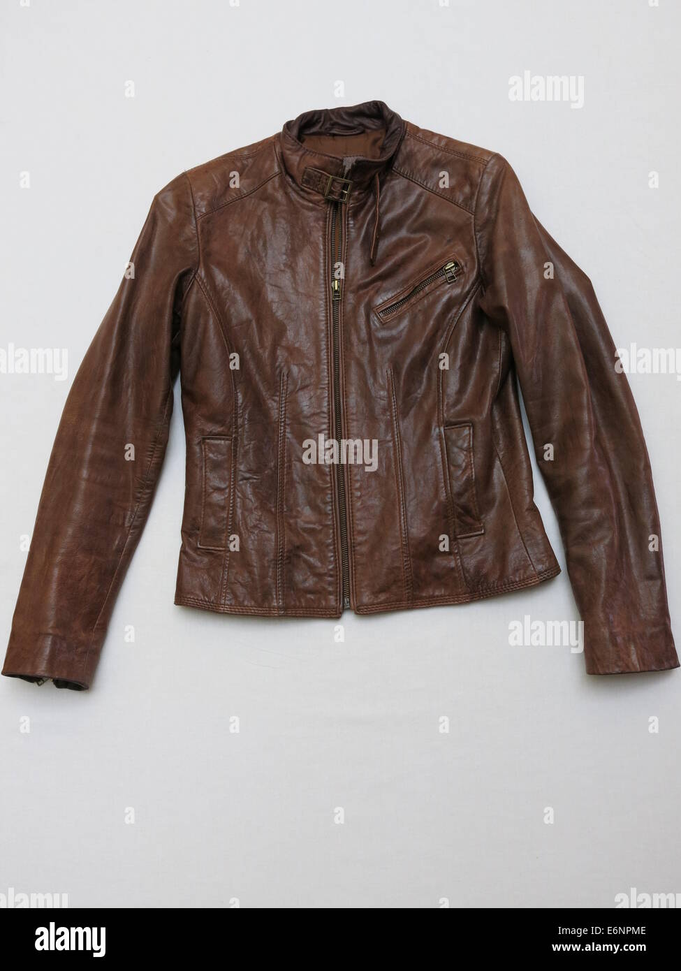 Brown leather jacket isolated against white background. Stock Photo