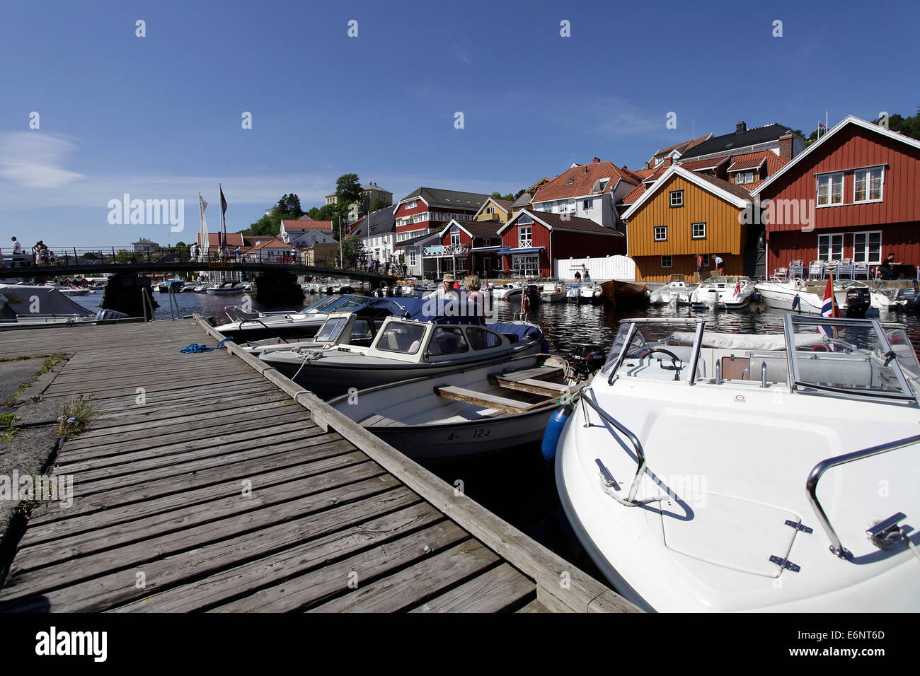 Narrow alleys and picturesque colorful wooden houses characterize Kragero that spread over three islands on the south coast of Norway on Skaggerak. Photo: Klaus Nowottnick Date: May 30, 2014 Stock Photo