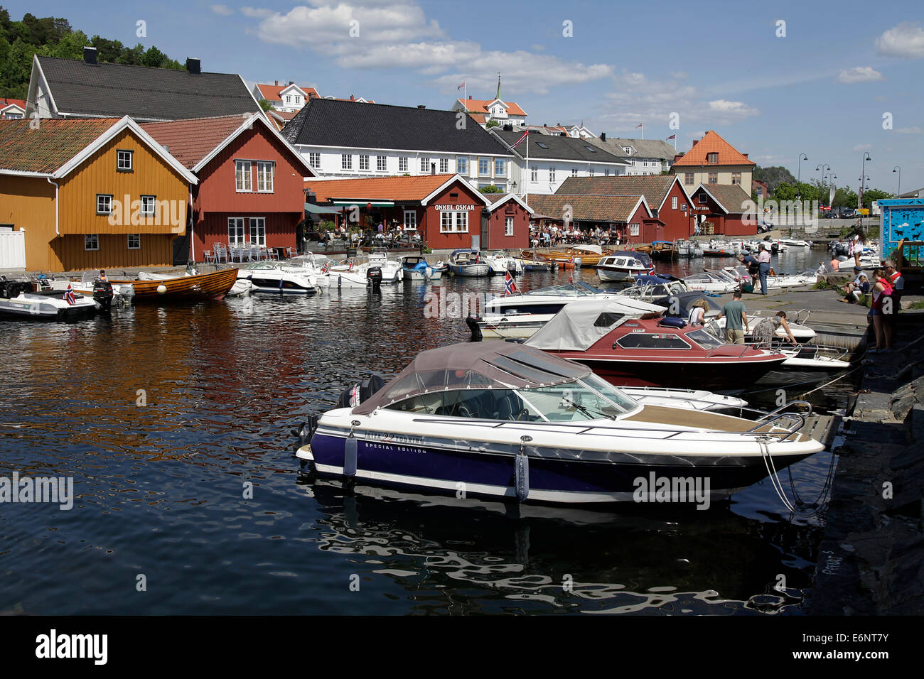 Narrow alleys and picturesque colorful wooden houses characterize Kragero that spread over three islands on the south coast of Norway on Skaggerak. Photo: Klaus Nowottnick Date: May 30, 2014 Stock Photo