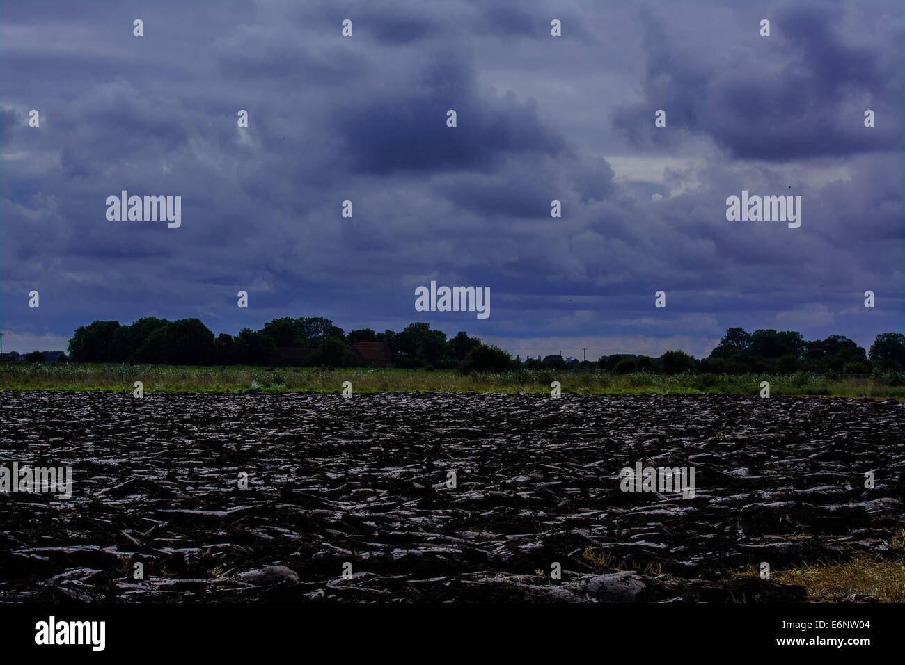 Plough and stormy sky Stock Photo - Alamy