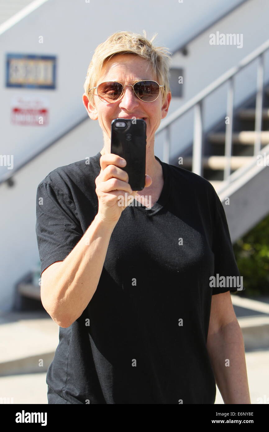 Ellen Degeneres in good spirits as she videos the paparazzi while Stock ...