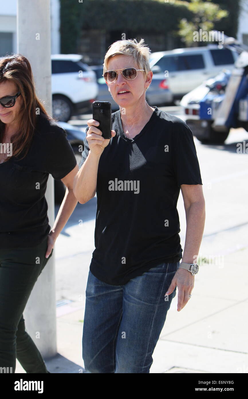 Ellen Degeneres in good spirits as she videos the paparazzi while Stock ...