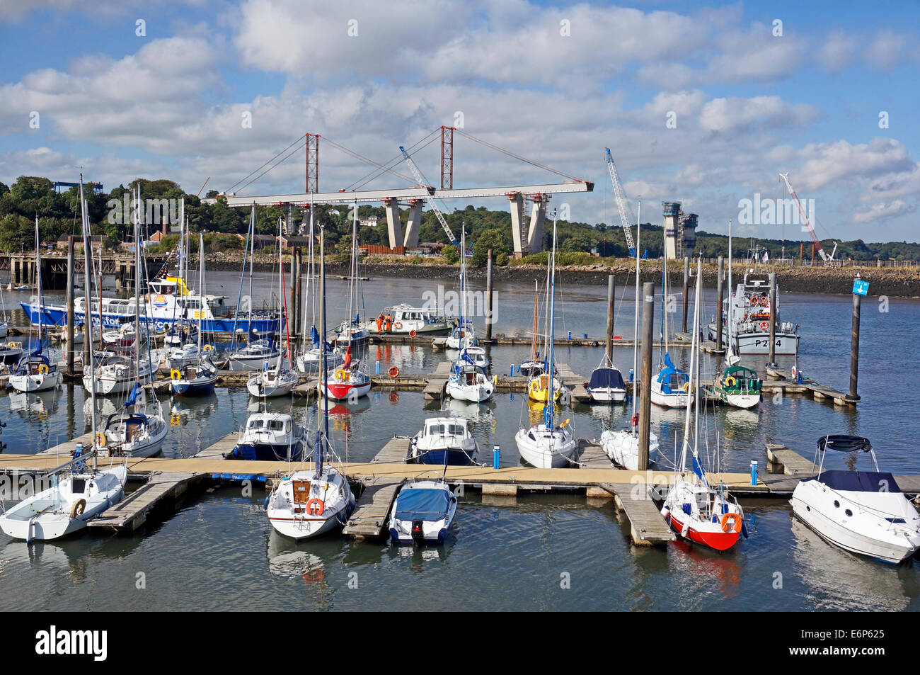 Progress in building the Queensferry Crossing over the Firth of Forth between Lothian and Fife in Scotland with Port Edgar boats Stock Photo