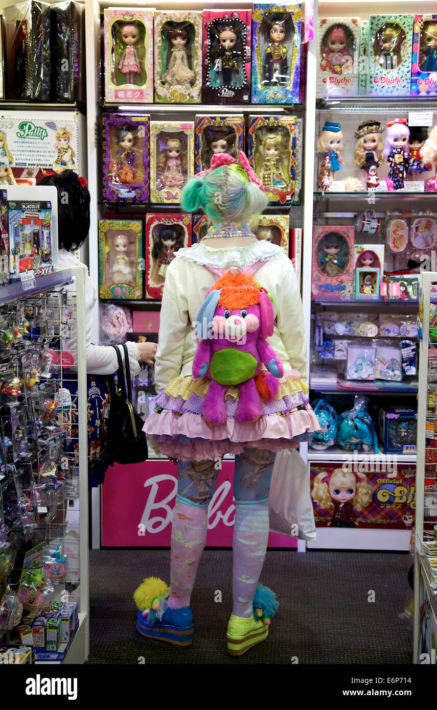 Young woman, girl, teen, female teenager shopping and buying doll or toy in shop. Manga, anime, comics. Omote-sando, Harajuku, Tokyo, Japan, Asia Stock Photo