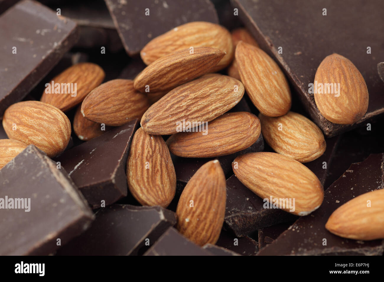 Almonds on chocolate pieces Stock Photo