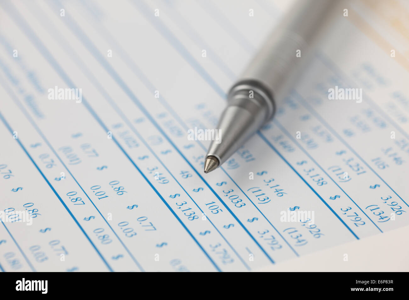 Ballpoint pen on financial statements. Stock Photo