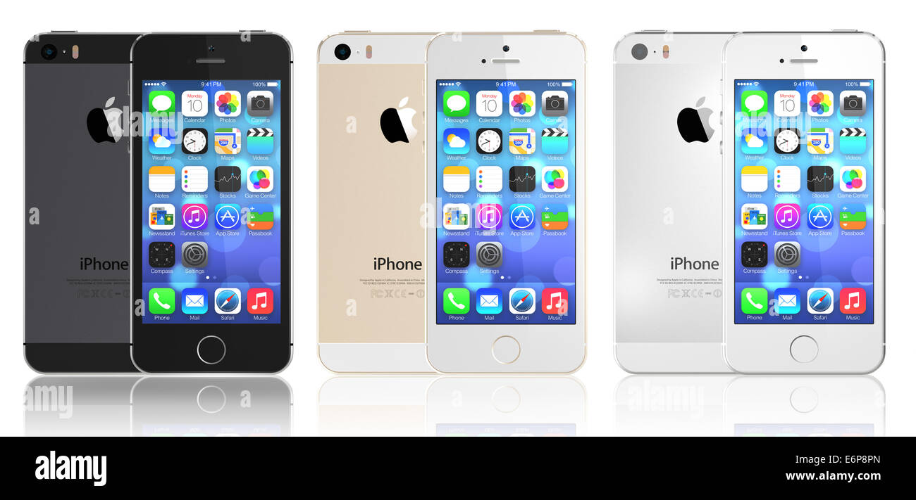 Space Gray, Silver, Gold iPhone 5s showing the home screen with iOS7. Stock Photo