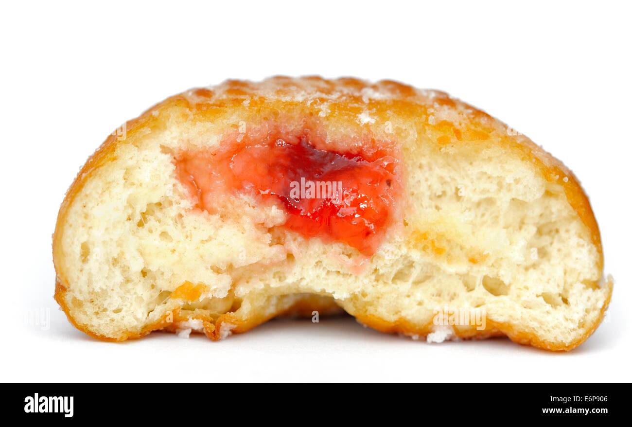 A jam doughnut cut in half with strawberry jam Stock Photo Alamy