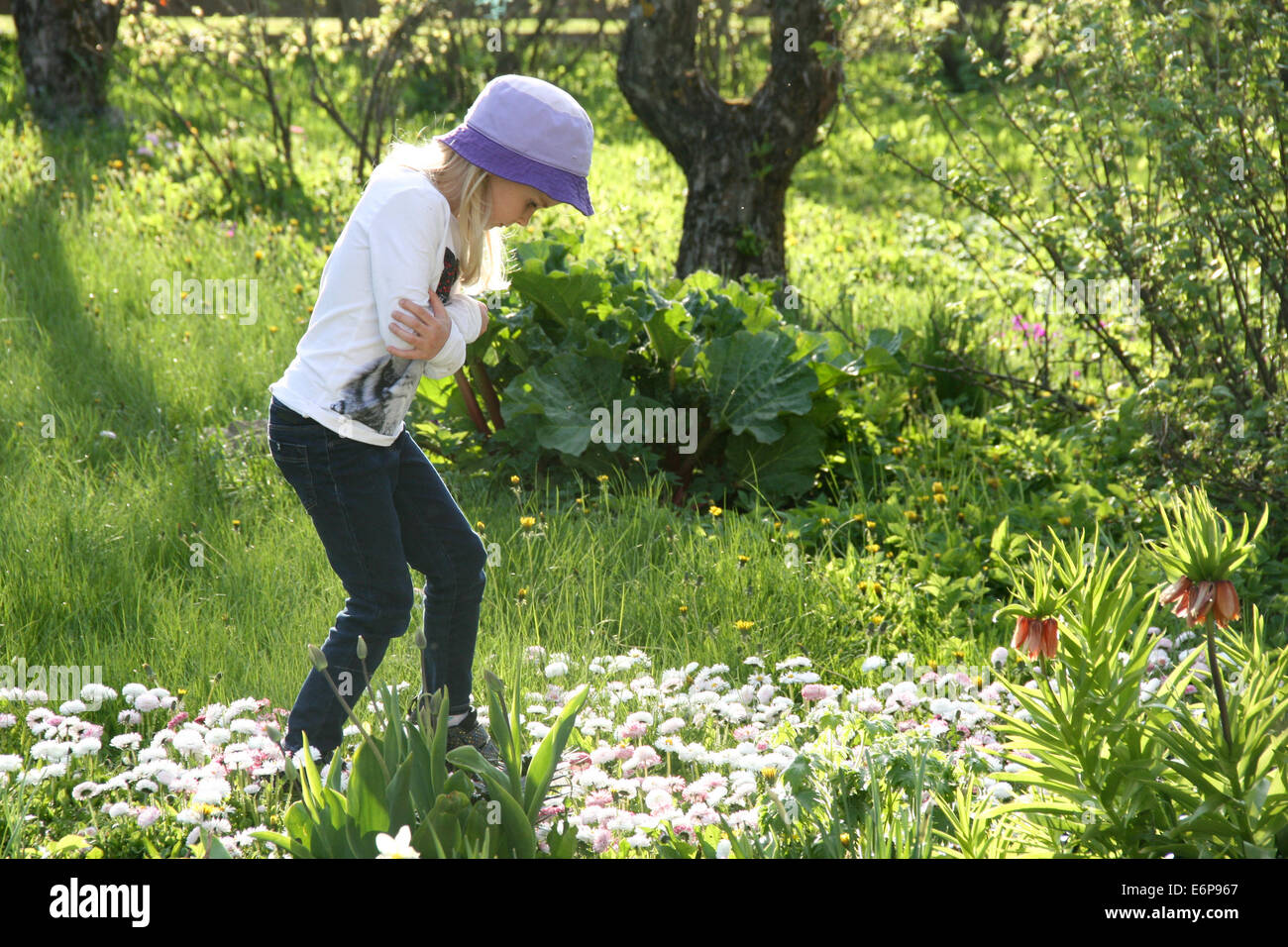 Girl walking in the garden Stock Photo