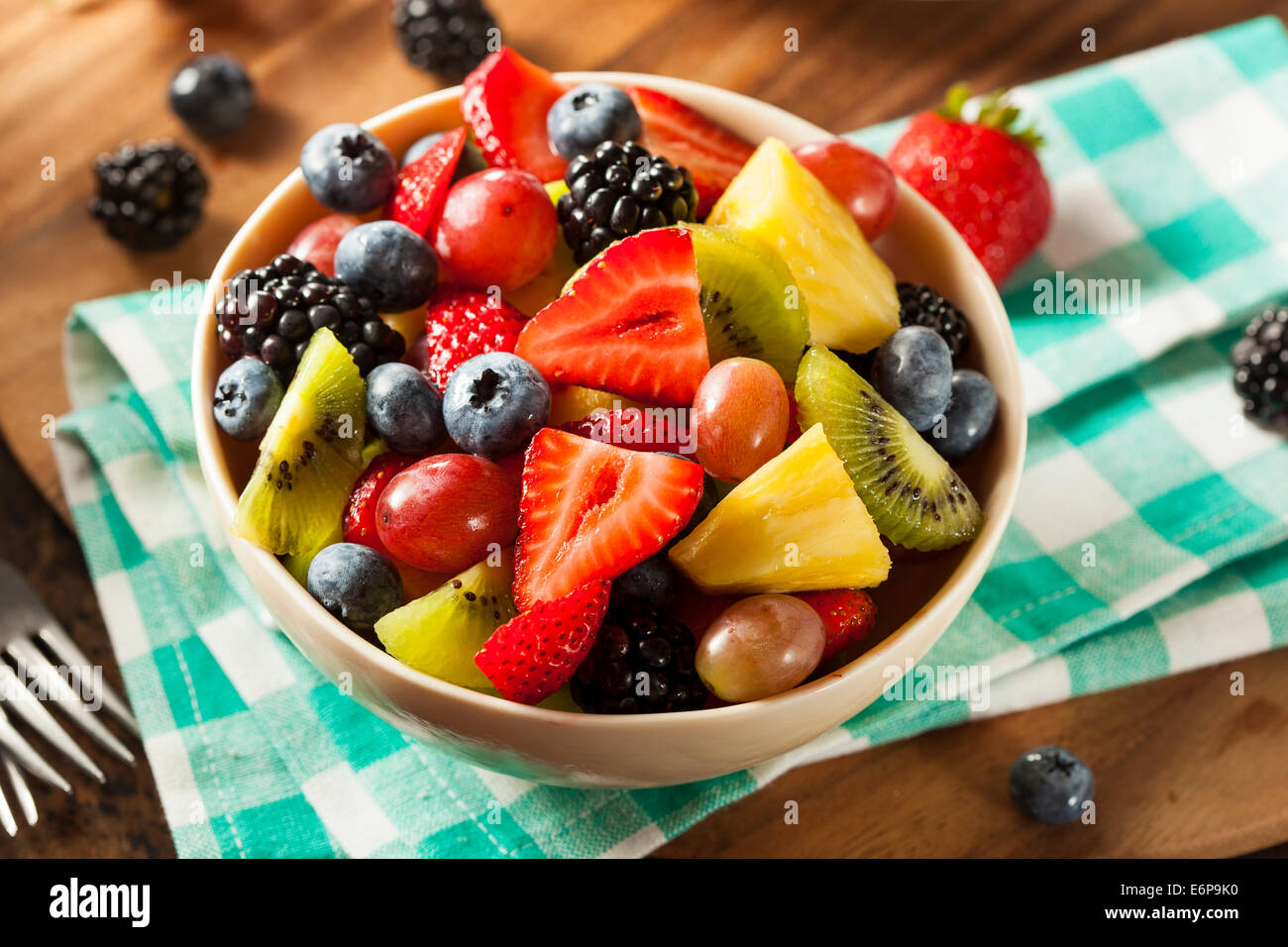 Heallthy Organic Fruit Salad with Berries Pineapple and Grapes Stock Photo