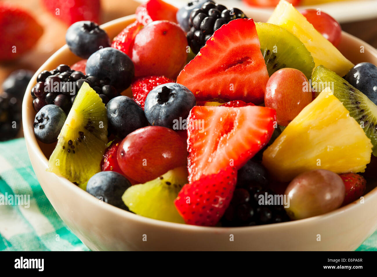 Heallthy Organic Fruit Salad with Berries Pineapple and Grapes Stock Photo