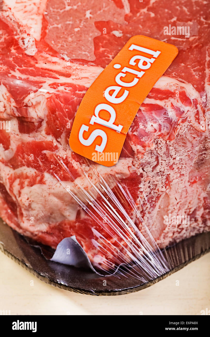 A roast of beef on sale and marked with a special sticker Stock Photo Alamy