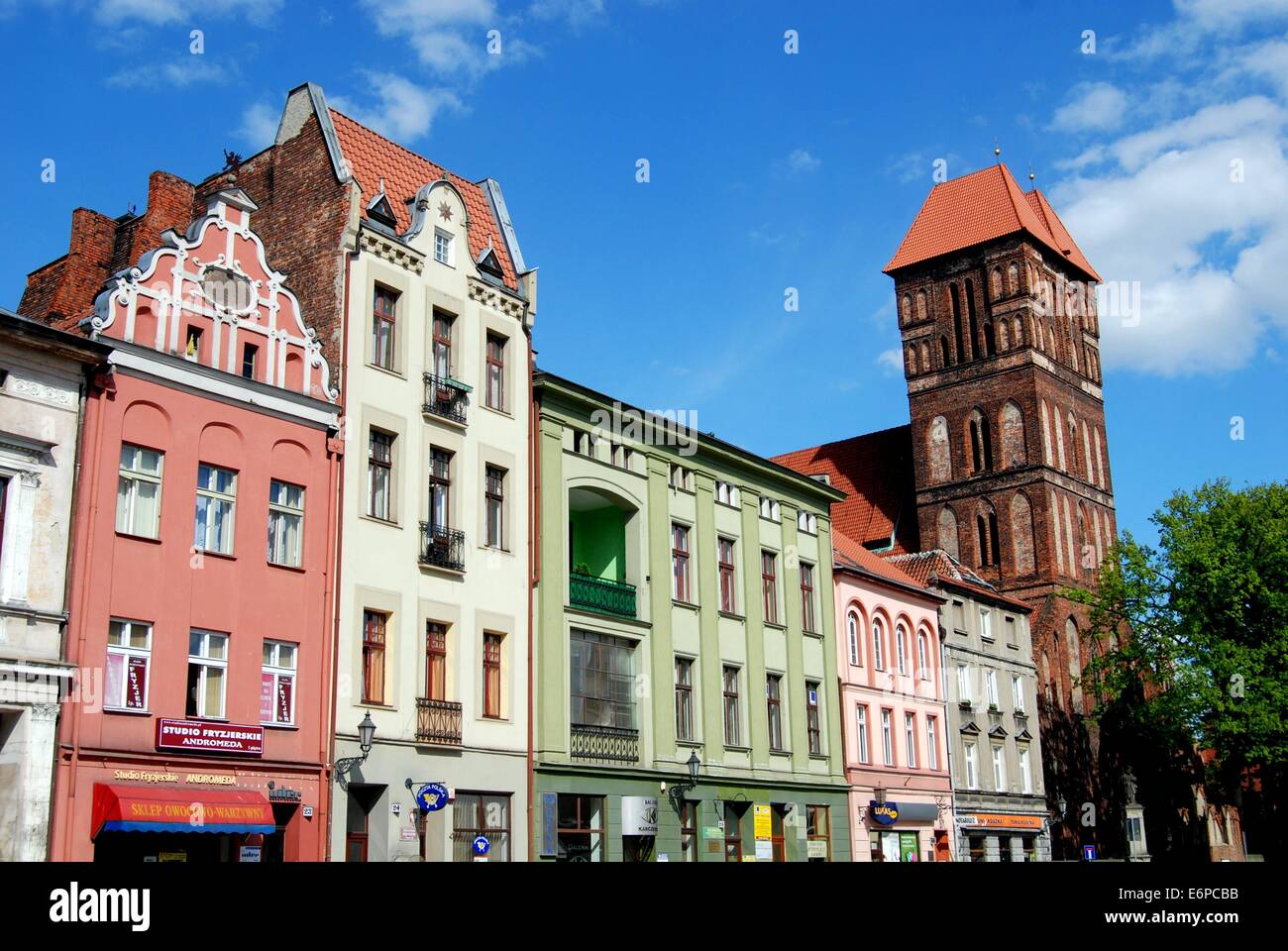 TORUN, POLAND:  View of the New Town Square with its colourful 18th and 19th century houses and the imposing Church of St. James Stock Photo