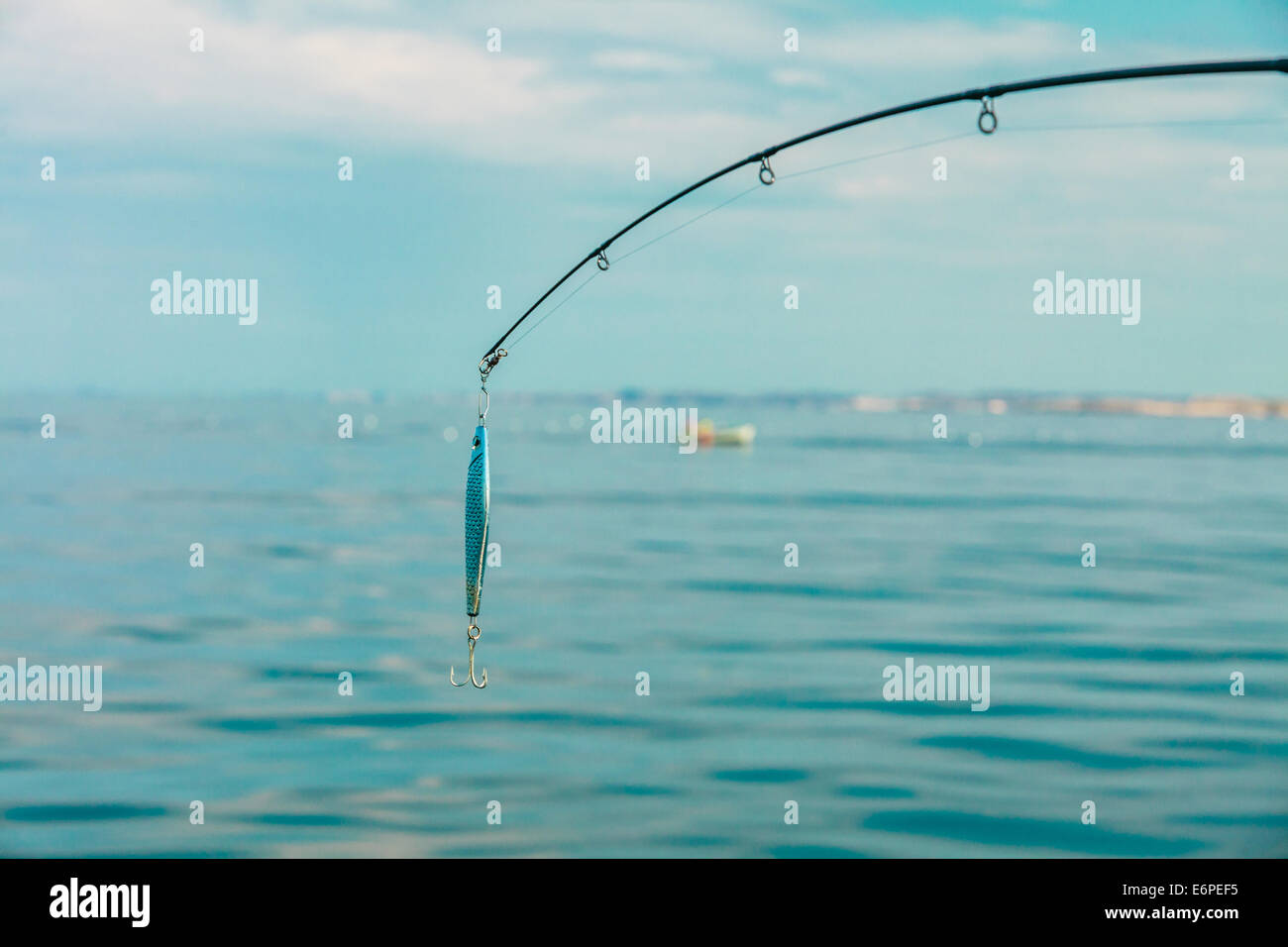 Fishing Bait-Rod with Float against the Blue Sea Water Surface, closeup  Stock Photo - Alamy