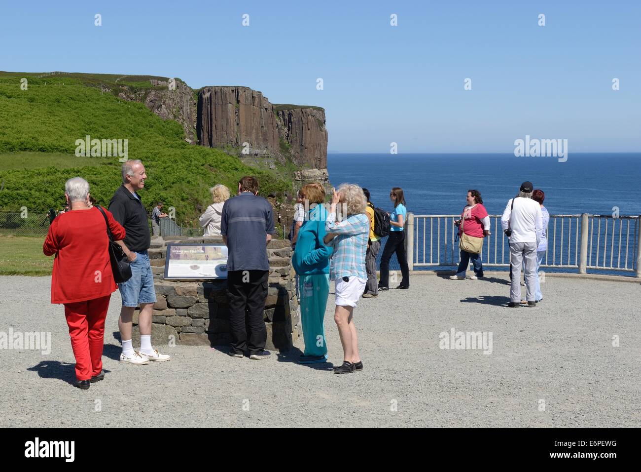 Tourists stop to take in the view at the kilt rock on the Isle of Skye, Scotland Stock Photo