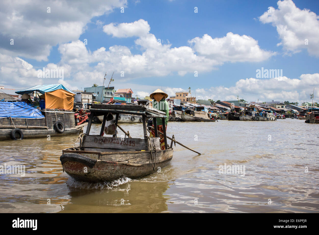 River view of Cai Rang Floating Market, near Can Tho, Mekong Delta, south Vietnam. early in the morning under a cloudy sky. Stock Photo