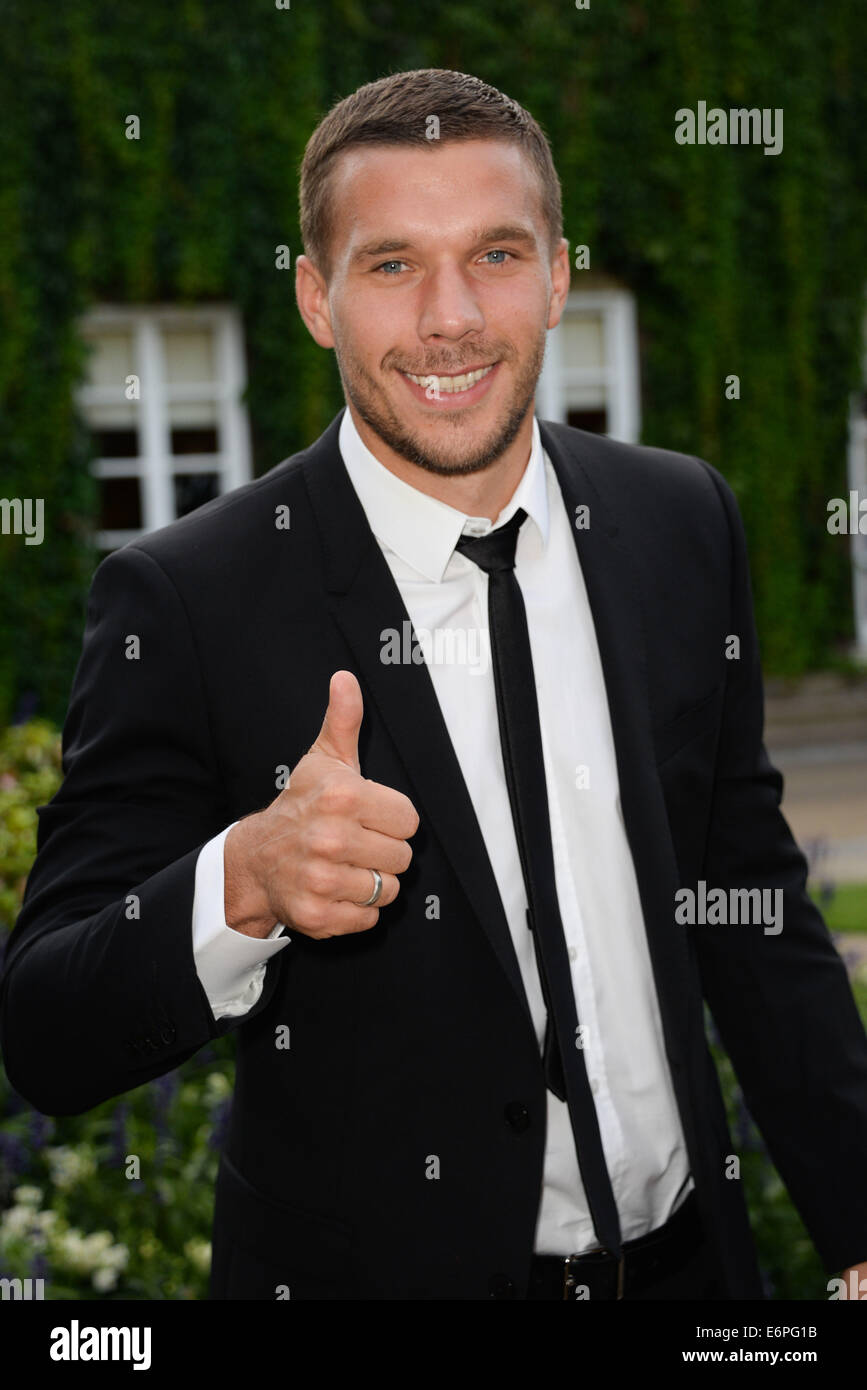 London, UK. 28th August, 2014. Lukas Podolski attends the Mo Farah Foundation Night Of Champions Dinner fundraising ball to celebrate champions from all walks of life, as well as raising funds for the continued development of Mo Farah Foundation projects at The Hurlingham Club in London. Credit:  See Li/Alamy Live News Stock Photo