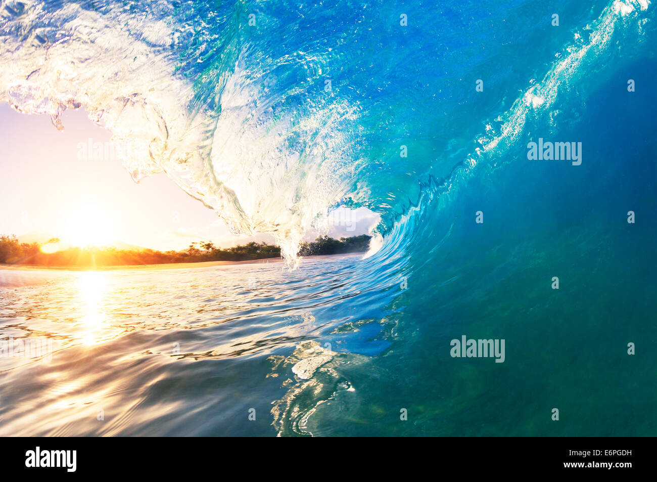 Ocean Wave at Sunrise Stock Photo - Alamy