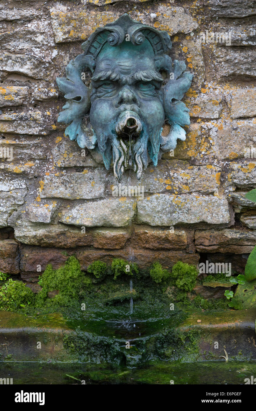Green Man wall fountain at Snowshill Manor in the Cotswolds Stock Photo