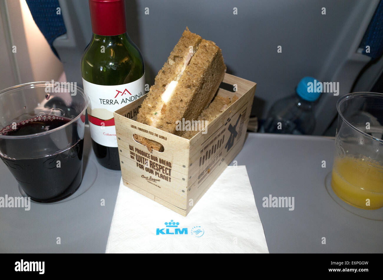 Sandwich wine and orange juice lunch on a KLM airplane flying between Warsaw and Amsterdam. Warsaw Poland Stock Photo