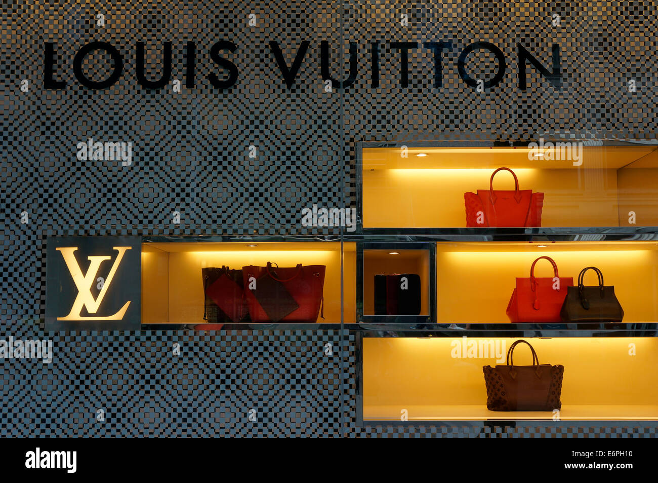 Louis Vuitton women's handbags displayed in the window of Holt Renfrew  department store, Vancouver, BC, Canada Stock Photo - Alamy