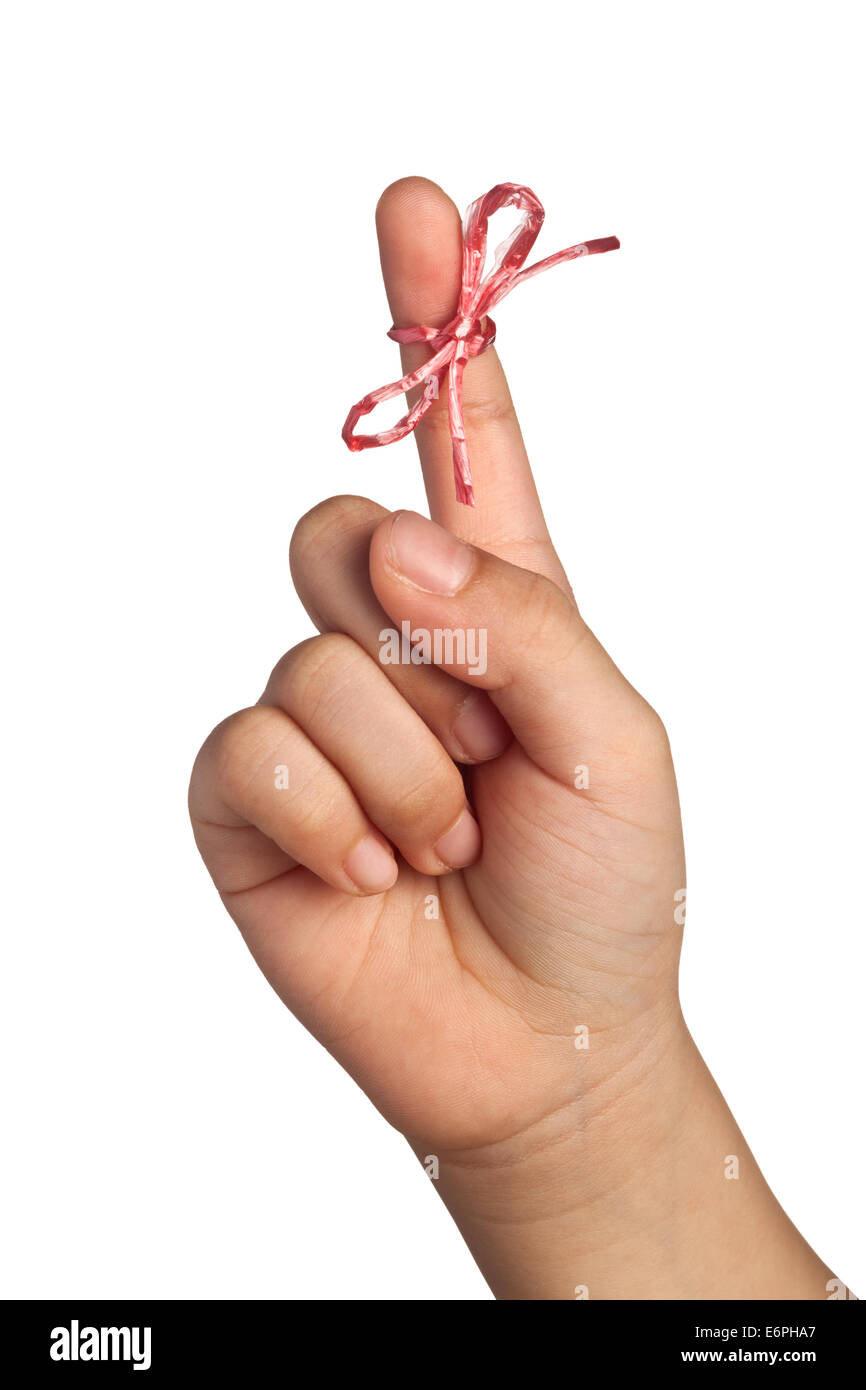 String tied on child's finger as reminder isolated on white background Stock Photo