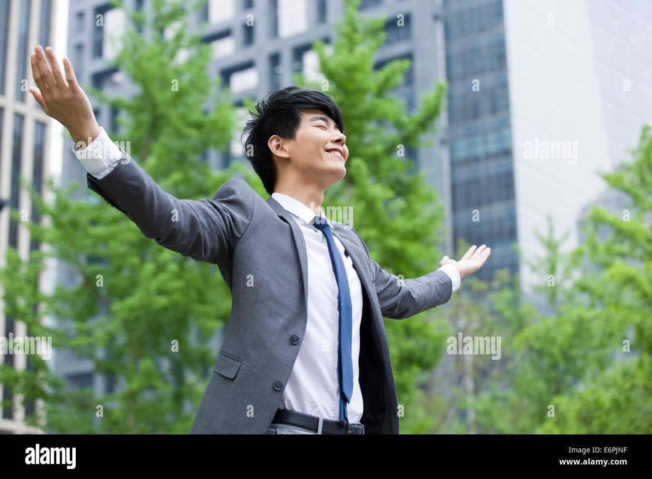 Side profile of a businessman standing with his arms crossed Stock ...