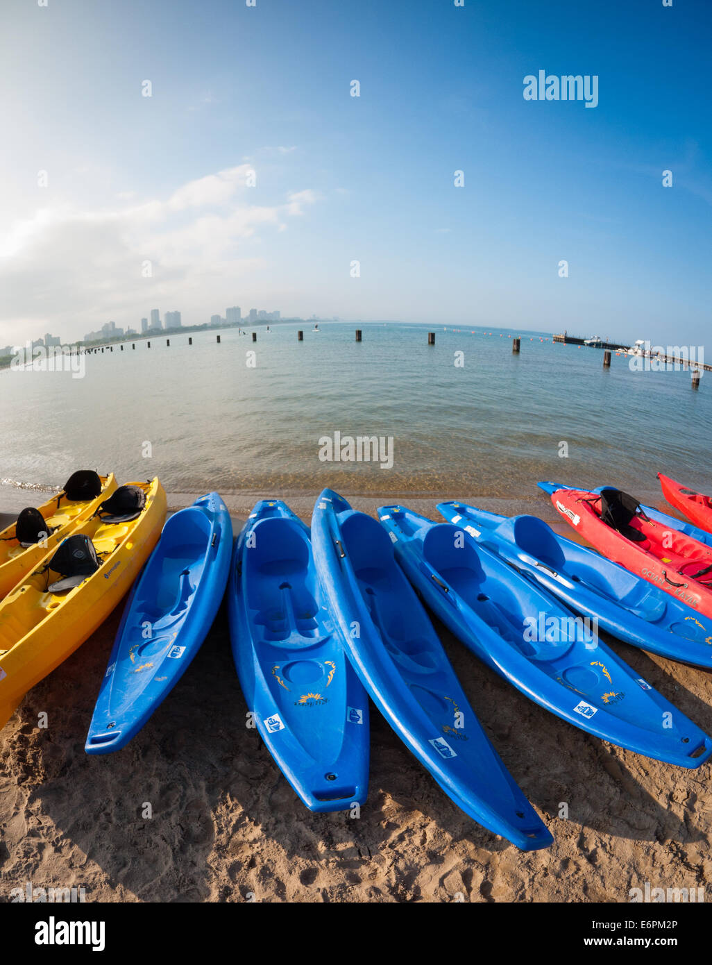 Colorful kayaks line the shore of North Avenue Beach on Lake Michigan, in the Gold Coast district of Chicago, Illinois. Stock Photo